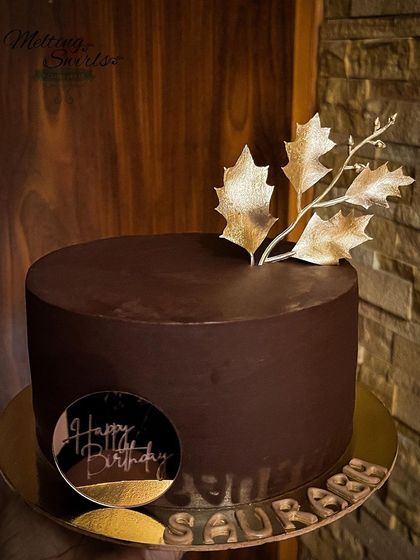 Sometimes, less is more. This rich coverture ganache cake is simply decorated with a single gold leaf accent, letting the deep chocolate flavor speak for itself.