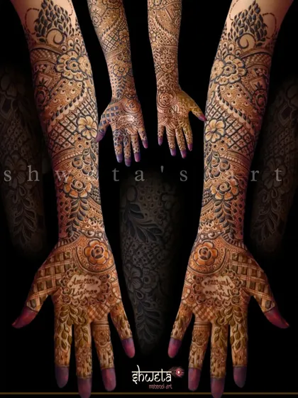 A full-coverage bridal design that is both dense and delicate. The pattern uses a combination of floral motifs and fine-line jaali work to create a rich texture.