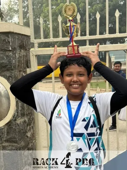 The joy of achievement! Pulkit Sugara with his trophy and medal after a successful run at the Pragyan School Inter-School Tournament.