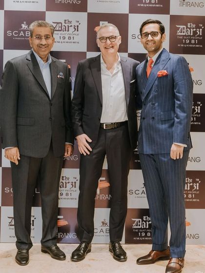 A photograph commemorating the successful event with Mr. Gregor Thissen of Scabal. Pictured here are the leaders of our two organizations, celebrating a partnership rooted in quality and craftsmanship.