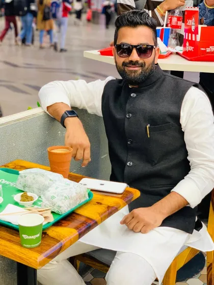 Enjoying a simple meal of chai and a roll. Creating your own opportunities often means working on the go.