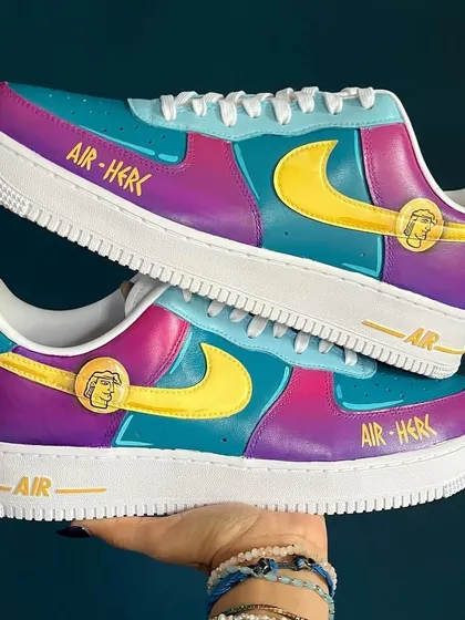 A fun, Hercules-inspired pair of custom Nike AF1s with a vibrant color-blocked design and the nickname "Air-Herc."