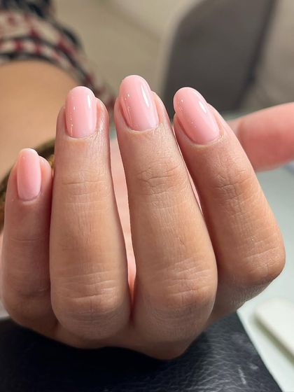 A close-up of a finished Russian manicure. The cuticle area is perfectly clean, which not only looks beautiful but also allows for a closer color application and longer-lasting results.