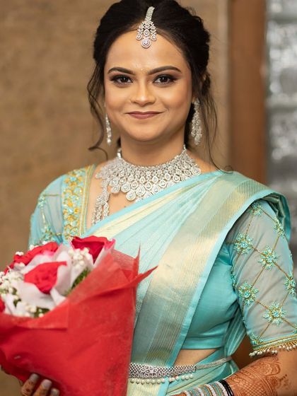 A lovely portrait of Samskruthi. The sparkling CZ jewellery gives her a radiant and modern bridal look.