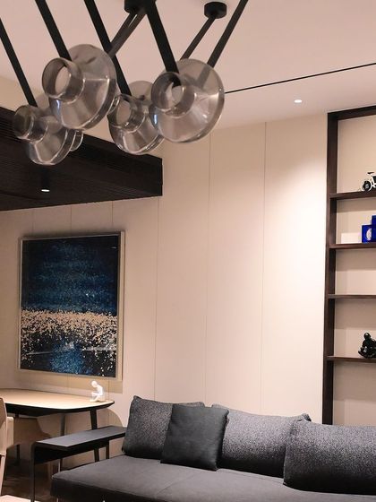 The lighting in this living area is carefully designed to highlight architectural details and artwork. Smart controls allow the homeowner to easily switch between different focal points.