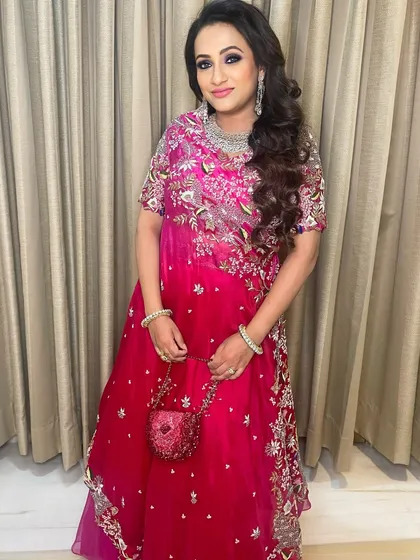 A full-length view of this beautiful party look. The makeup is perfectly balanced, with defined eyes and a soft lip that lets the stunning outfit shine.