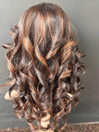 This molten honey colored wig is one of our most glamorous custom pieces. It's perfect for everyday wear and is made with high-quality Remy hair.