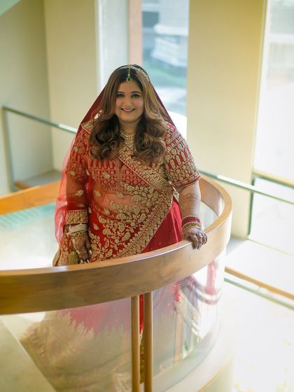 A smiling shot of the bride, looking down from the staircase. Her happiness and confidence are what my work is all about.