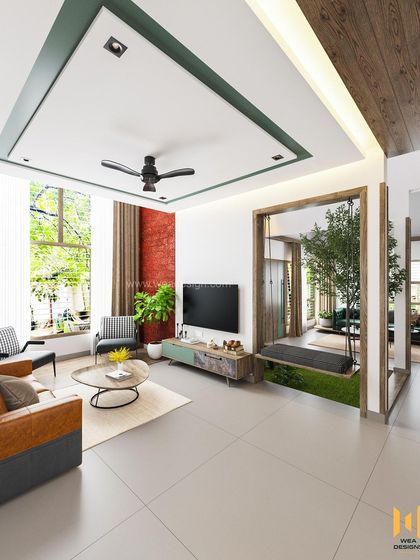 A wide view of the living room, showing the indoor swing and the connection to the rest of the open-plan space.