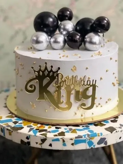 A "Birthday King" topper on a cake, perfect for making someone feel like royalty on their special day.