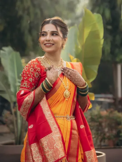 A radiant portrait of a Maharashtrian bride, showcasing the perfect harmony between makeup, hair, and traditional attire.