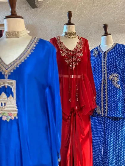 This edit includes bold, contemporary designs. I particularly love the architectural embroidery on the blue kurta and the delicate lacework on the red peplum top with its draped skirt.