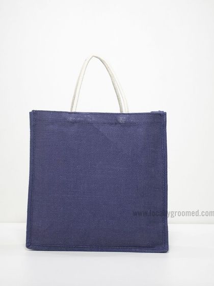 A simple and versatile navy blue jute bag with plain white handles, ready for your custom branding.