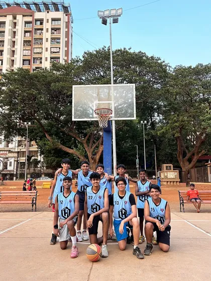 The U-18 Team Redeem posing for a photo on the court.