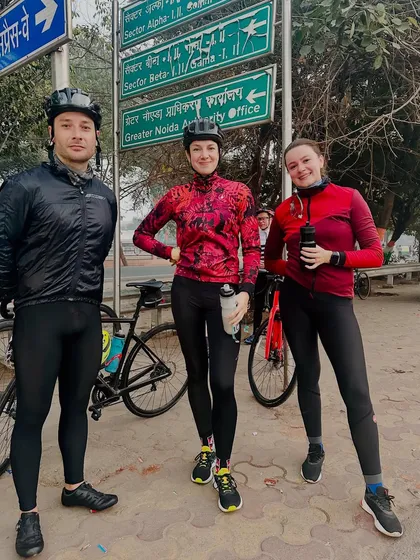 Taking a quick break by a route map. Our Sunday rides often explore new routes in and around the city.