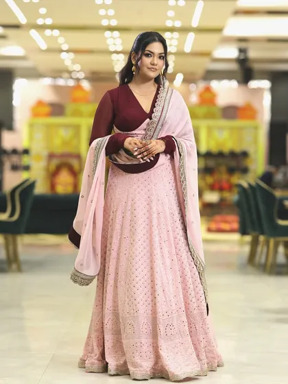 For special occasions, I love embracing timeless elegance. This beautiful pink lehenga with a contrasting maroon blouse was my choice for a family celebration. The focus is on a flattering silhouette and delicate embroidery.