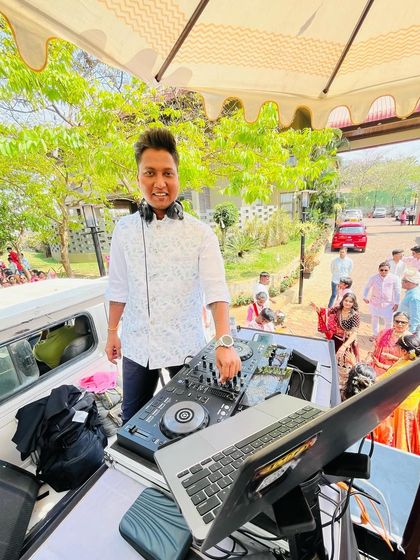 A clear day and a happy crowd make for the perfect Baraat. Here I am on my mobile console, ready to get everyone dancing.