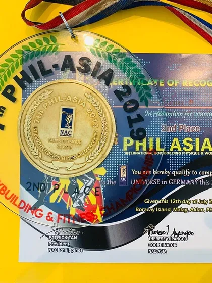 This is my first international medal, a silver from the Mr. Asia 2019 competition. It represents years of dedication and serves as proof of the high standards I set for myself and my clients.