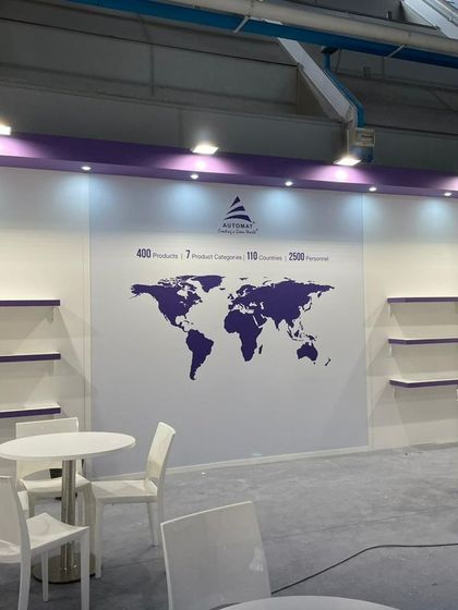 Setting up our global presence map at the EIMA 2022 booth. This wall highlights our reach across 110 countries, a testament to our journey.