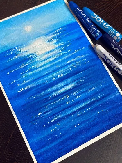 Playing with oil pastels to create this simple ocean scene. I blended different shades of blue to depict the water and used white to show the bright reflection of the sun.