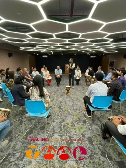 We can transform any space, even a modern corporate office, into a hub of rhythm and connection. Here, we're leading a team through an interactive drumming session designed to break down hierarchies and build genuine bonds.