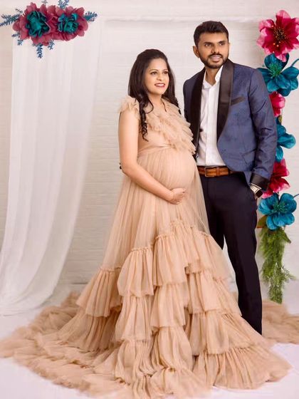 This pose beautifully showcases both the stunning ruffled gown and the happy couple. It’s a perfect blend of elegance and shared joy.