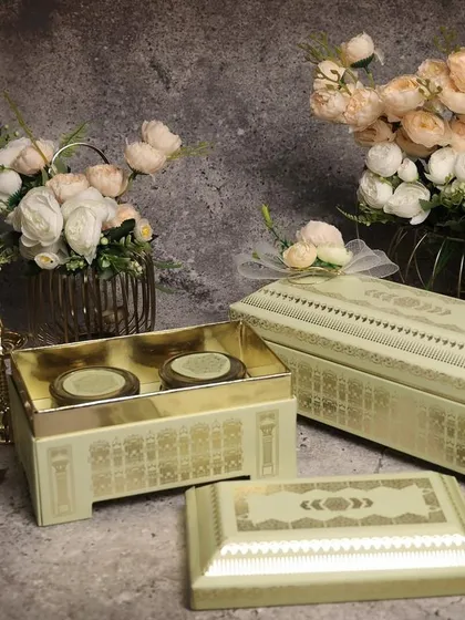 A set of elegant, minimalist gift boxes with a subtle pattern. This style is perfect for clients with a modern aesthetic.
