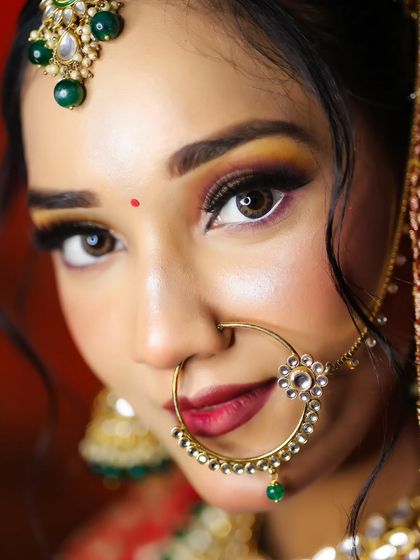 An extreme close-up on the eye makeup, showing the sharp winged liner and blended eyeshadow. Precision is key, and our mentors provide detailed feedback to perfect these skills.