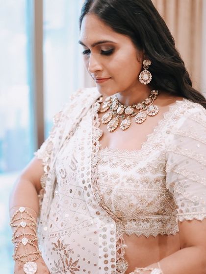 A beautiful shot of my baby shower look, featuring the custom hand harness. It was designed to complement my classic white uncut jadau necklace, creating a cohesive and modern heritage look.