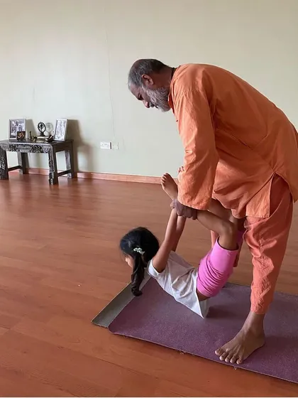 Yoga is for everyone, regardless of age. I enjoy sharing the practice with the youngest of students, here helping a child explore Dhanurasana (bow pose) in a gentle and supportive way during a program in Dubai.