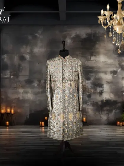 A testament to pure opulence, this emerald green velvet sherwani is detailed with exquisite Aari work and sparkling Swarovski stones. It is a piece designed for the groom who wants to embody Persian majesty and timeless luxury.