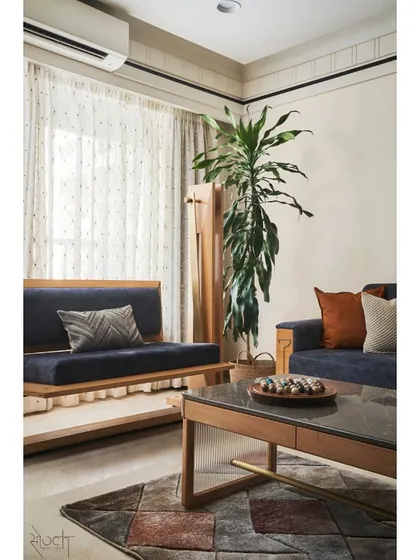 The living room of Virali Villa reflects a more serene, Zen-inspired aesthetic. I used natural oak wood for the sofa and swing settee, paired with a calming color palette, to create a tranquil and comfortable space for the family to relax and unwind.