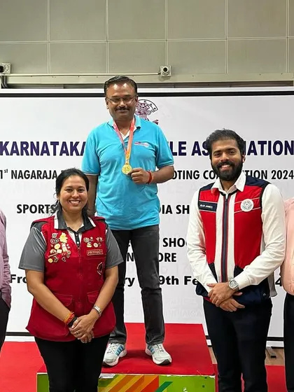 Krishna Prasad on the podium after winning the Gold medal in the 10M Air Pistol Master Men category at the Nagaraj Rao Shooting championship.