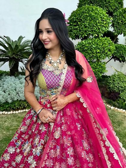 A lovely candid shot. Her multi-layered necklace and soft makeup create a beautiful, fresh look.