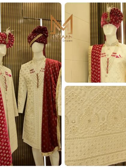 Our showroom display featuring a classic off-white sherwani with a contrasting red velvet stole and safa. This combination offers a traditional and royal look for any groom.