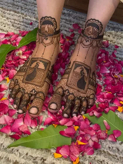 Another shot of the peacock leg design, highlighting the symmetry and detailed work on the toes and top of the feet.