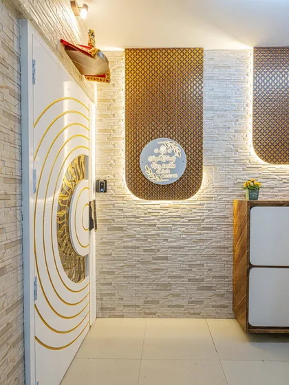 This is the full view of a grand entrance I created. The design includes the custom main door, a backlit nameplate, textured wall panels, and a sleek shoe cabinet, all working together to make a strong first impression.