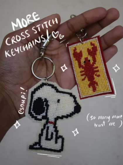 Here are a couple more of my pop culture cross-stitch keychains. I had so much fun making this classic Snoopy design and the lobster banner. Each one is carefully stitched and finished with a durable backing so they can handle daily use.