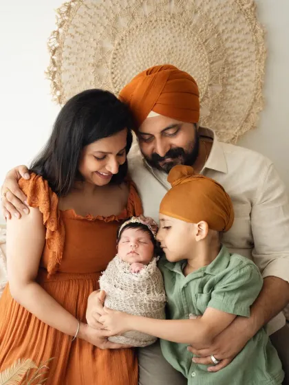 A heartwarming portrait of a family with their newborn and older son. My family photoshoots are designed to be relaxed and capture your natural connections.