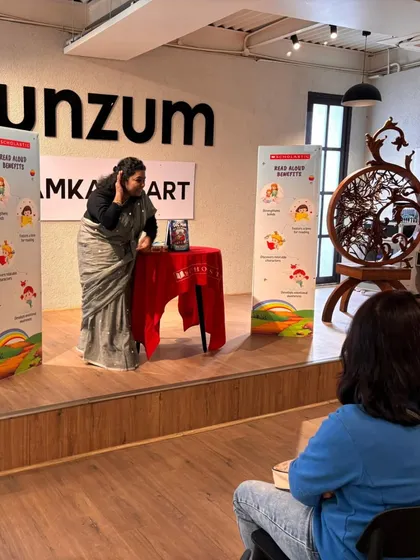 The storyteller using gestures and expressions to animate the tale of Dogman. Our stage is set up to host these kinds of energetic and theatrical readings for children.