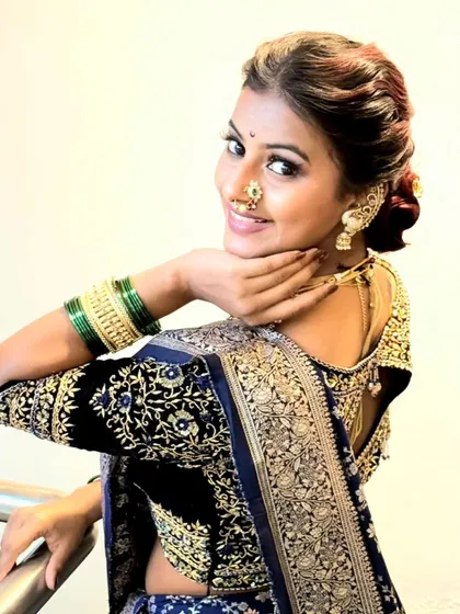A view of the back, showing the elegant hairstyle and the way the saree's border frames the shoulders. A well-executed drape looks beautiful from every angle, and that is what I strive to teach.
