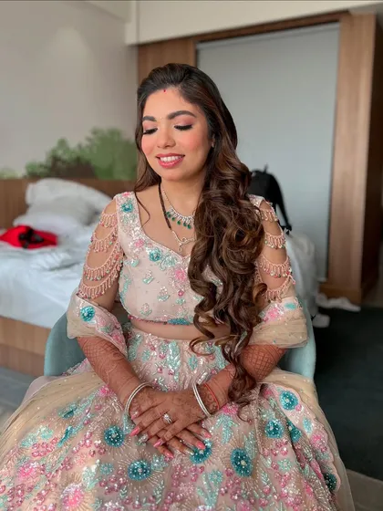 A close-up showcasing the soft, blended eyeshadow and perfect nude-pink lip we chose for Kejal's reception. It’s all about enhancing, not overpowering.