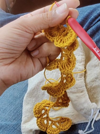 Another view of my on-the-go crochet project. This shows the spiral pattern of the yellow flower as it's being created.