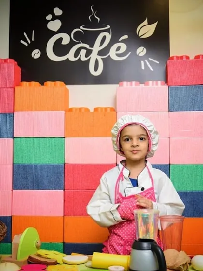 What's cooking? This little chef is ready to whip up some fun in our pretend play kitchen.