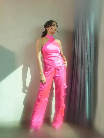Another full-length pose that captures a thoughtful, off-gaze moment, adding a touch of narrative to the fashion story.