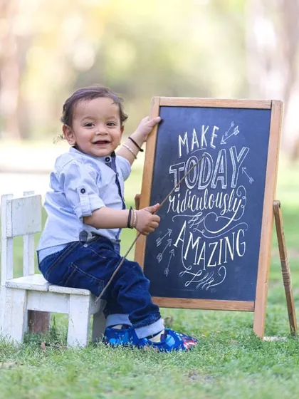 A positive message for a happy little guy. I use props like chalkboards to add a personal and inspirational touch to my sessions.