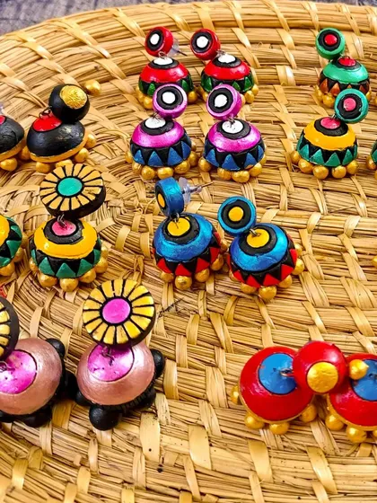 A duplicate image of the two-tiered jhumkas with striped details.