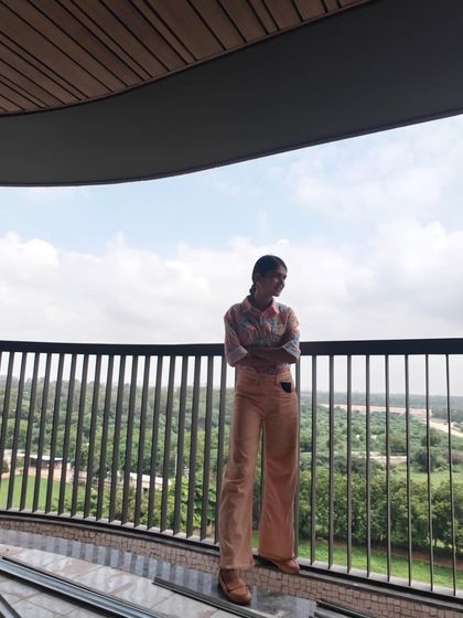 Taking a moment during a site visit to absorb the view and atmosphere. Understanding the environment is key to creating art that feels right for the space.
