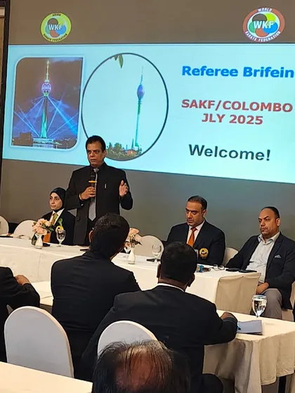 Addressing officials during a referee briefing for a South Asian Karate Federation event in Colombo. Clear communication and instruction are vital.