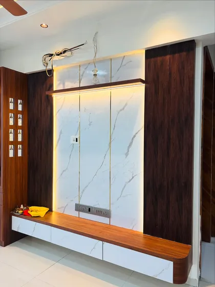 A wider shot of the TV unit and adjacent mandir, showing how I integrate different functional units into a single wall for a clean, organized look. The wiring is neatly concealed behind the panels.